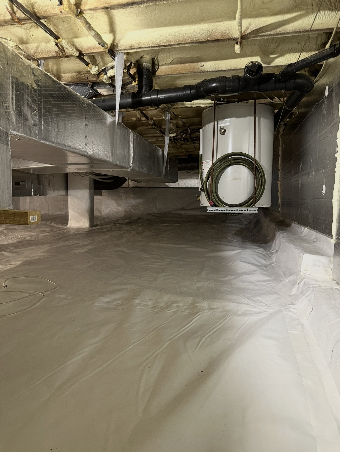 After: Dirty Basement with Water Heater → Clean Encapsulated Space